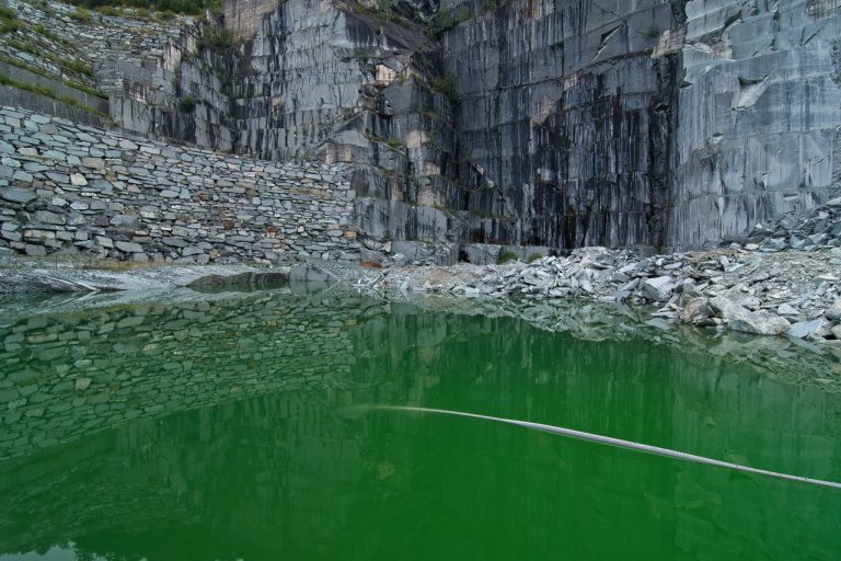 Abandoned serpentine quarry in the italian mountain