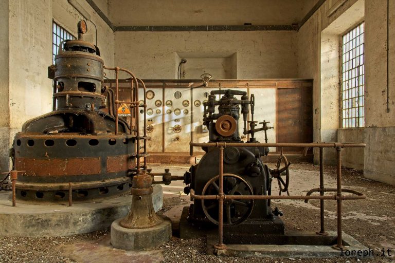 Turbine and generator Brown Boveri inside an abandoned hydro power plant